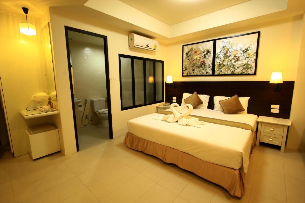 @ White Patong Hotel Quarto foto